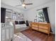 Bright bedroom featuring dark-tone hardwood floors and well-lit window at 1136 W Harvard St, Orlando, FL 32804