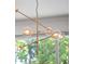 Contemporary chandelier with globe-shaped lights and brass accents at 1136 W Harvard St, Orlando, FL 32804