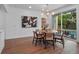 Dining area with a round table, chairs, and sliding glass doors leading to the pool area at 1136 W Harvard St, Orlando, FL 32804