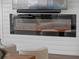 Modern electric fireplace framed by white shiplap, creating a cozy ambiance at 1136 W Harvard St, Orlando, FL 32804