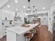 Eat-in kitchen with stainless steel appliances, large island with bar seating and pendant lights at 1136 W Harvard St, Orlando, FL 32804