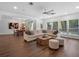 Open concept living area with a dining area leading to a living room featuring a large sofa and modern decor at 1136 W Harvard St, Orlando, FL 32804
