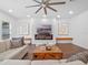 Comfortable living room featuring a large sectional sofa, modern decor, and a fireplace at 1136 W Harvard St, Orlando, FL 32804