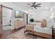 Bright bedroom featuring ceiling fan, lamps, and natural light at 1136 W Harvard St, Orlando, FL 32804