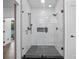 Contemporary shower with subway tile, glass door, and contrasting dark fixtures at 1136 W Harvard St, Orlando, FL 32804