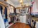 Organized walk-in closet with shelving and plenty of hanging space for clothes and accessories at 1136 W Harvard St, Orlando, FL 32804