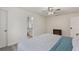 Bright bedroom featuring neutral walls, ceiling fan, and an ensuite bathroom at 1500 Pinecrest Pl, Orlando, FL 32803