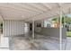 View of the carport, front door and home's exterior at 1500 Pinecrest Pl, Orlando, FL 32803