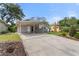 Lovely home featuring a convenient carport, well-kept lawn, and appealing curb appeal at 1500 Pinecrest Pl, Orlando, FL 32803
