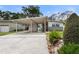Charming single-Gathering home with a covered carport, lush landscaping, and a well-maintained front yard at 1500 Pinecrest Pl, Orlando, FL 32803