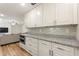 Modern kitchen with stainless steel appliances, granite counters and tile backsplash at 1500 Pinecrest Pl, Orlando, FL 32803