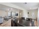 Open-concept space with an dining area leading to the living room featuring contemporary furnishings and ample lighting at 1500 Pinecrest Pl, Orlando, FL 32803