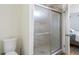 Bathroom shower with glass doors and updated hardware at 1500 Pinecrest Pl, Orlando, FL 32803