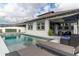 Poolside deck with lounge furniture, screened-in patio, and sunshades at 15313 Lebeau Loop, Winter Garden, FL 34787
