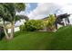 Landscaped backyard with a lush lawn and privacy fence at 15313 Lebeau Loop, Winter Garden, FL 34787