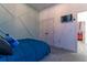 The spacious bedroom features gray carpet, a television, and a double-door closet at 15313 Lebeau Loop, Winter Garden, FL 34787