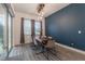 Modern dining room with wood table, stylish chairs, and contemporary lighting fixture at 15313 Lebeau Loop, Winter Garden, FL 34787