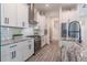 Bright kitchen with white cabinets, granite countertops and stainless steel appliances at 15313 Lebeau Loop, Winter Garden, FL 34787