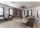 Spacious living room with hardwood floors, a decorative fireplace, and modern furnishings at 15313 Lebeau Loop, Winter Garden, FL 34787