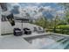 Backyard pool with lounge chairs and umbrella at 15313 Lebeau Loop, Winter Garden, FL 34787