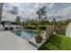 Backyard pool and landscaping, including planter at 15313 Lebeau Loop, Winter Garden, FL 34787