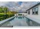 Backyard pool with water feature and deck at 15313 Lebeau Loop, Winter Garden, FL 34787
