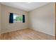 Bedroom features a large window that provides natural light and vinyl flooring at 2051 Pernod Ct, Apopka, FL 32703