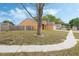Home featuring a well-maintained lawn and a convenient attached garage at 2051 Pernod Ct, Apopka, FL 32703