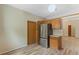 Cozy kitchen featuring wood cabinets and stainless steel refrigerator at 2051 Pernod Ct, Apopka, FL 32703