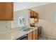 Functional kitchen with a breakfast bar, stainless steel appliances, and wood cabinetry at 2051 Pernod Ct, Apopka, FL 32703