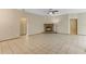 Spacious living room featuring tile floors, a cozy fireplace, and an open floor plan at 2051 Pernod Ct, Apopka, FL 32703