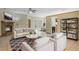Inviting living room with a cozy fireplace, neutral-toned furniture, modern decor, and bright natural light at 2051 Pernod Ct, Apopka, FL 32703