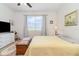 Comfortable bedroom with large window, carpet flooring, and simple decor at 2587 Cliff Way, St Cloud, FL 34771