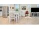 Cozy dining area features white table and chairs, creating an inviting space for meals at 2587 Cliff Way, St Cloud, FL 34771