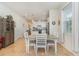 Open-concept dining area with neutral color palette and view of the kitchen at 2587 Cliff Way, St Cloud, FL 34771