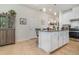 Kitchen with white cabinetry, granite countertops, stainless appliances, and breakfast bar seating at 2587 Cliff Way, St Cloud, FL 34771