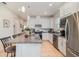 Bright kitchen with granite countertops, stainless steel appliances, and ample cabinet space at 2587 Cliff Way, St Cloud, FL 34771
