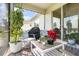 Relaxing screened patio with cozy seating and vibrant plants, perfect for enjoying outdoor moments at 2587 Cliff Way, St Cloud, FL 34771