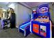 Arcade featuring an Injustice video game, and a basketball toss game, for the residents of the Windsor Hills community at 2781 Almaton Loop # 203, Kissimmee, FL 34747