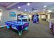 Arcade featuring an air hockey table, a claw machine, and various video arcade games, for the residents of the community at 2781 Almaton Loop # 203, Kissimmee, FL 34747