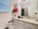 Bright bathroom featuring granite countertop vanity and shower with decorative tiling at 2781 Almaton Loop # 203, Kissimmee, FL 34747
