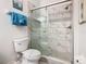 A bathroom featuring a toilet and a glass enclosed shower with tile surround at 2781 Almaton Loop # 203, Kissimmee, FL 34747