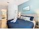 Comfortable bedroom with a modern design, ensuite bathroom, and soft, natural lighting at 2781 Almaton Loop # 203, Kissimmee, FL 34747
