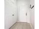 Bright foyer features white door, coat closet, and tile flooring at 2781 Almaton Loop # 203, Kissimmee, FL 34747