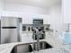 Stainless steel sink and appliances in the kitchen area with granite countertops at 2781 Almaton Loop # 203, Kissimmee, FL 34747