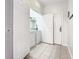 Tiled laundry room with washer and dryer hookups, ample storage, and exterior access at 2781 Almaton Loop # 203, Kissimmee, FL 34747