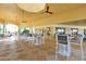 Spacious outdoor seating with stylish bar stools and tables perfect for gatherings and entertainment at 2781 Almaton Loop # 203, Kissimmee, FL 34747