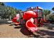 Community playground with castle themed play structure, slides, and benches at 2781 Almaton Loop # 203, Kissimmee, FL 34747