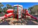 Community playground with castle themed play structure with multiple slides at 2781 Almaton Loop # 203, Kissimmee, FL 34747