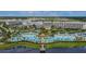 Stunning aerial view of resort pools, cabanas, and beautiful grounds, perfect for relaxation and recreation at 3205 Caribbean Soul Dr, Kissimmee, FL 34747